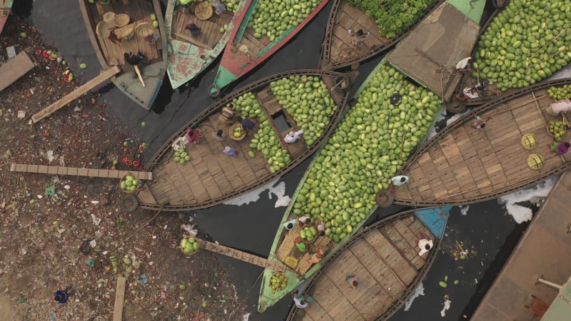 Aerial view of people working on boats in Dhaka, Bangladesh.