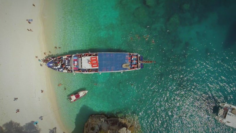 Aerial view of people disembarking off ferry, Ithaki island.