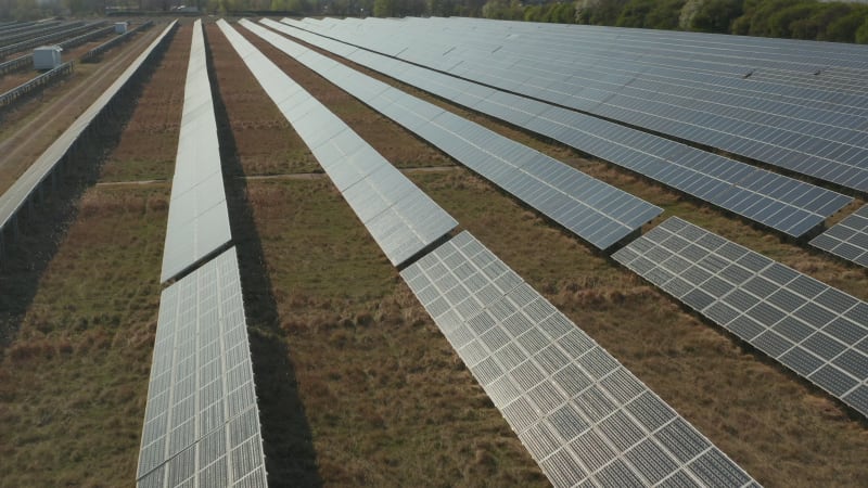 Flight over Solar Panel that produces Green, Environmentally friendly Energy from the Sun. Solar plant Park producing renewable energy for a sustainable Development