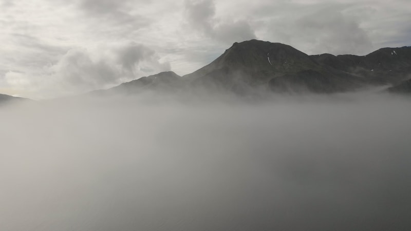 Aerial view of haze under a mountain in Alaska.