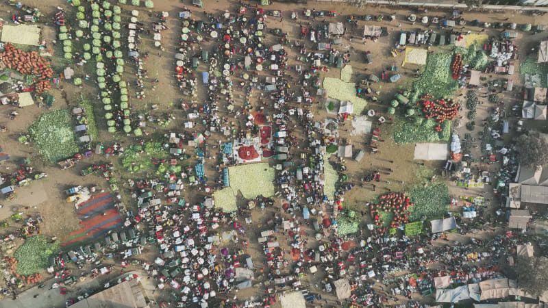 Aerial view of people in a food market in Shibganj, Rajshahi state, Bangladesh.