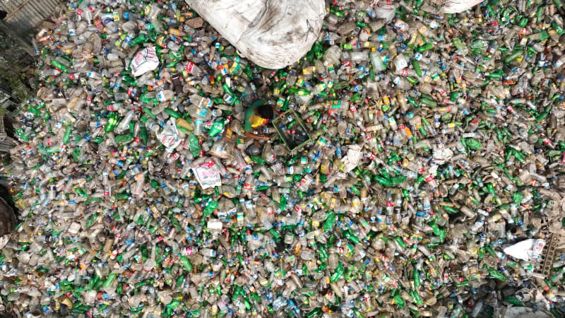 Aerial View of a person working in a plastic Waste treatment plant, Bangladesh.