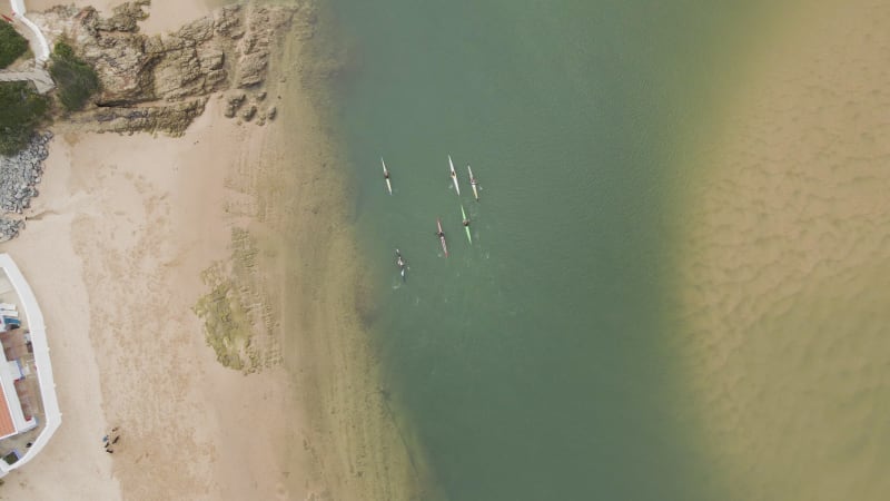 Aerial view of people doing kayak along Mira River, Portugal.