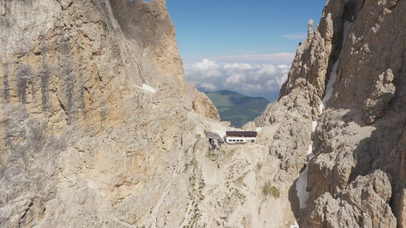 Circling around restaurant and cable car station in between Sassalungo (Langkofel) mountain range