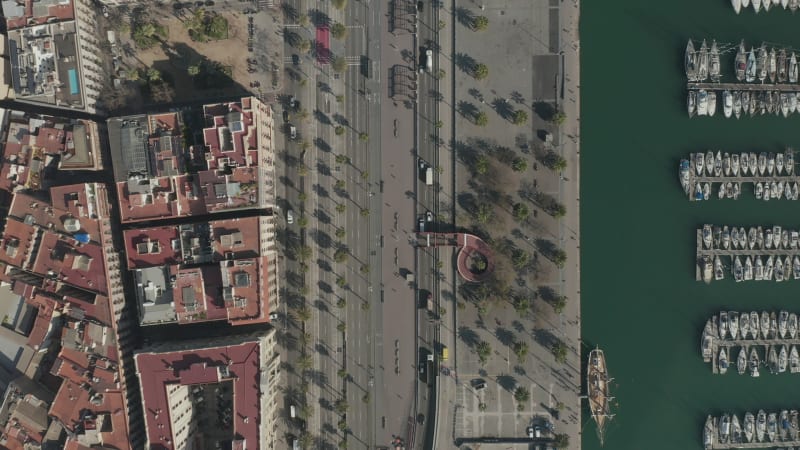 Overhead Shot along Barcelona, Spain Bay with Boats in water on Sunny Day