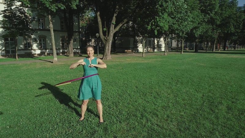 Aerial view of a woman with Hula Hoop in a park, Zagreb, Croatia.