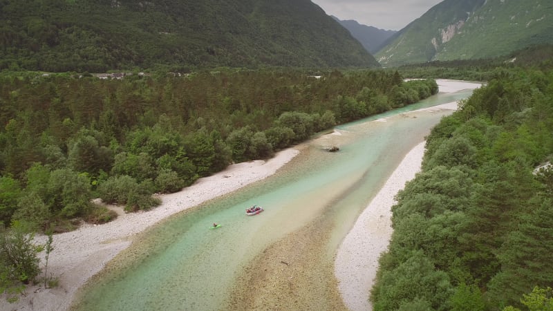 Aerial view of a group of people doing white water rafting.