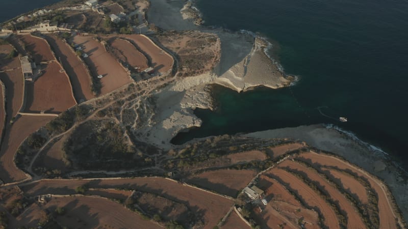 St Peter's Pool famous tourist spot on Malta Island with Tourism in Sunset Summer light, Aerial wide view