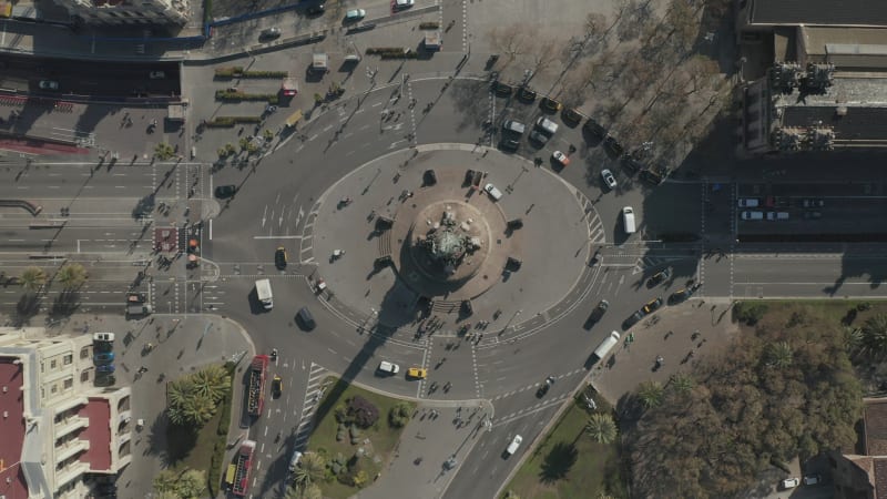 Overhead Shot of Columbus Monument Roundabout in Barcelona, Spain with Busy Car traffic on Sunny Day