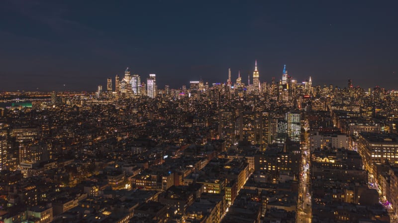 Aerial night city hyperlapse. illuminated streets and buildings. Skyline with downtown skyscrapers. Manhattan, New York City, USA