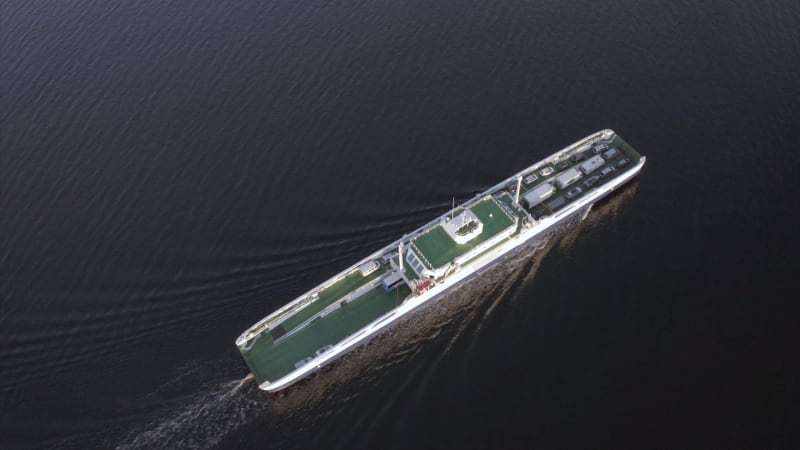 Ferry Seen From The Air Transporting Vehicles and Passengers