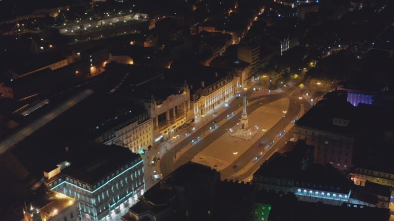 Aerial night view of Monumento aos Restauradores on public square with VIP Executive Eden Aparthotel building in Lisbon, Portugal