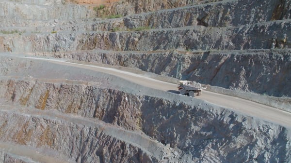 Large Vehicles Working Around a Large Open Quarry