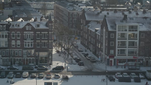 Beautiful traditional residential buildings in Rotterdam covered in snow