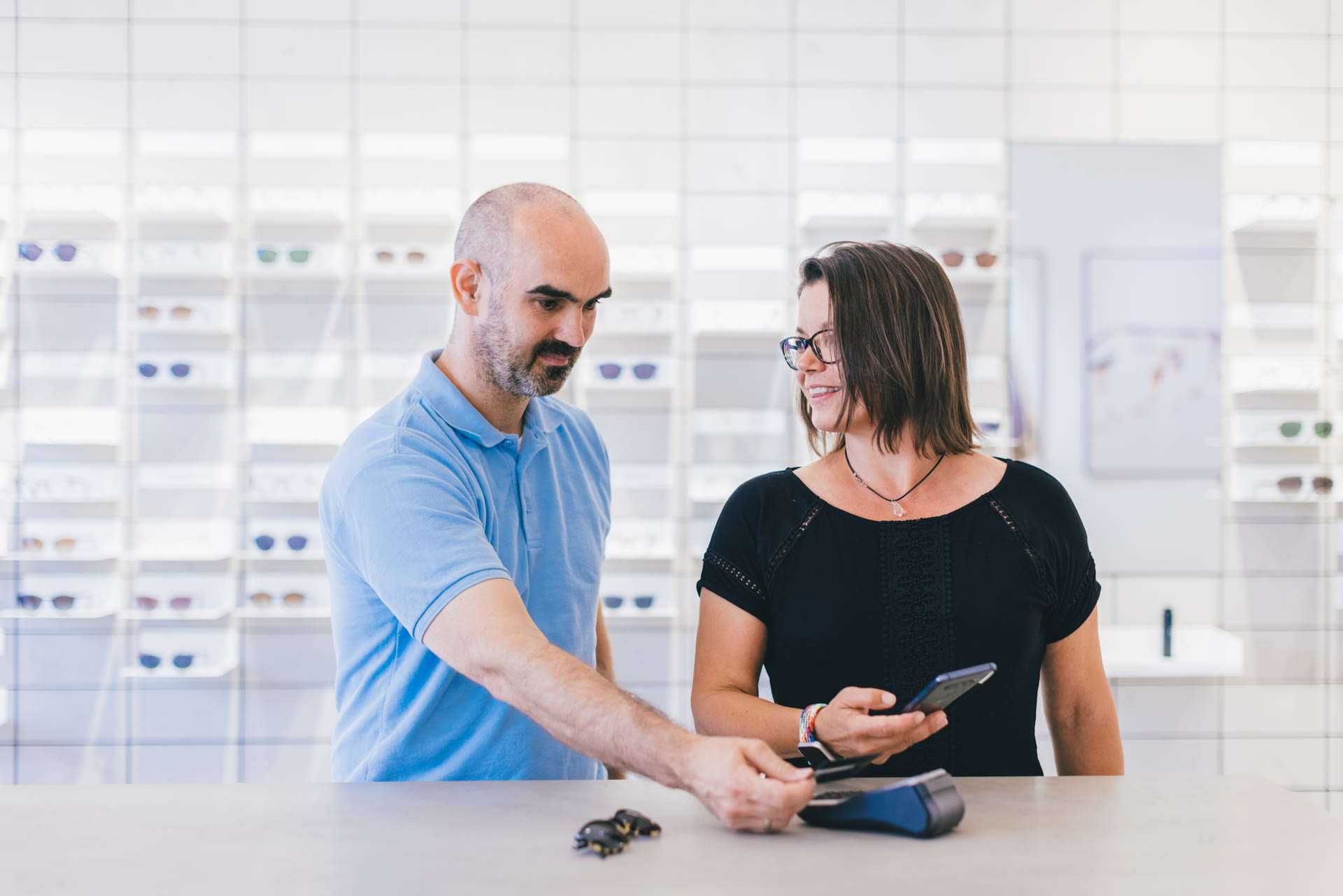 Woman and man who pay contactless.