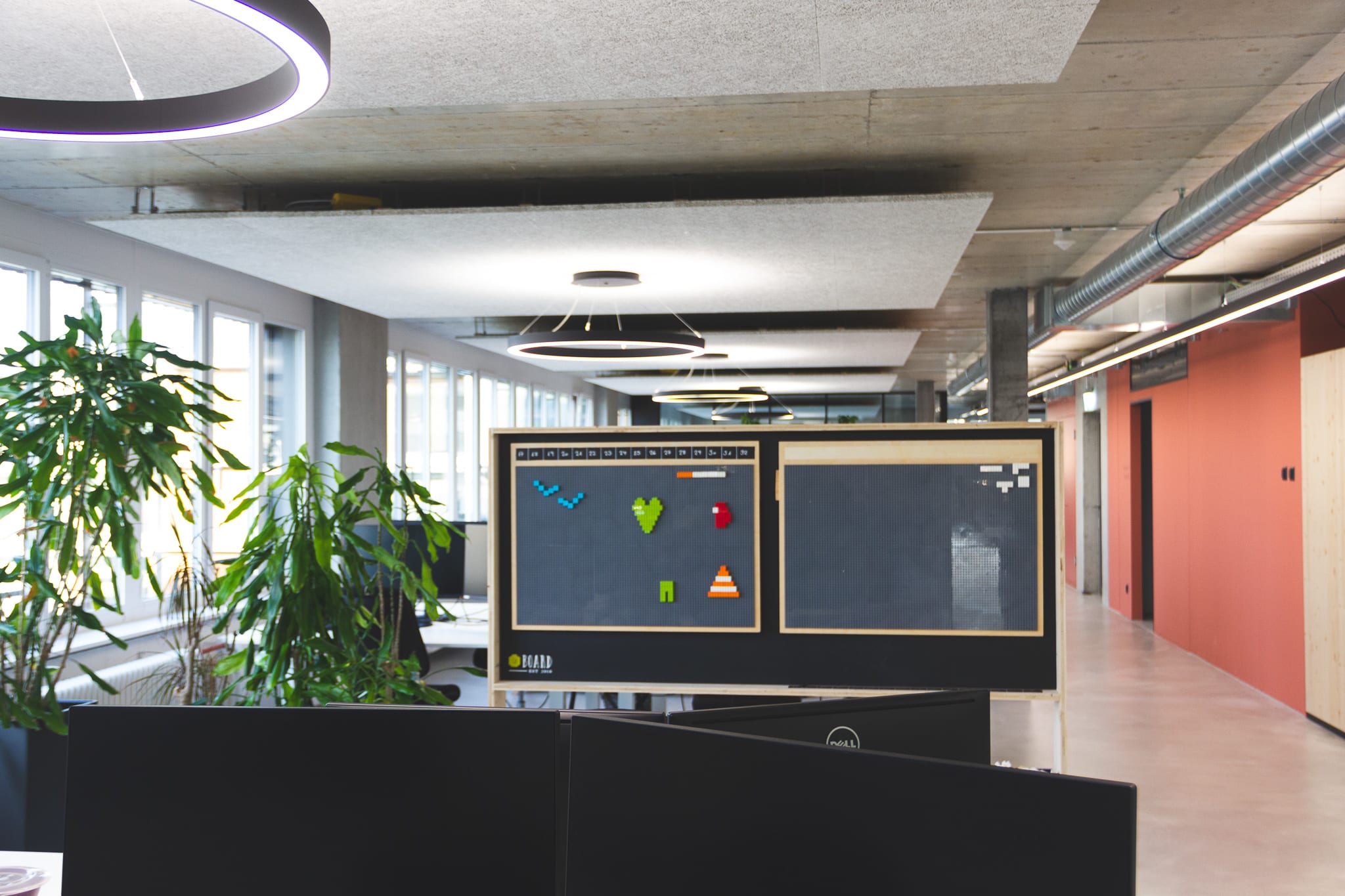 Open-plan office: Individual monitors or workstations can be recognised.