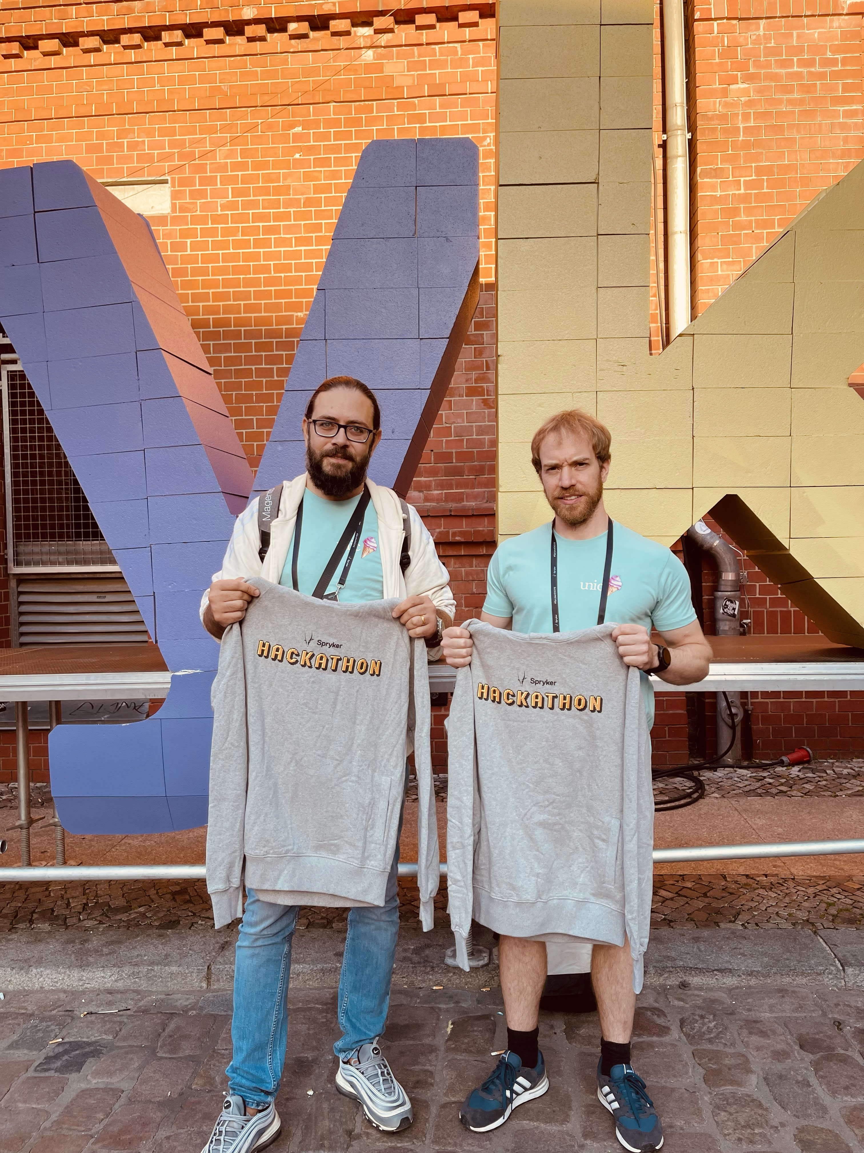 The winners of the Spryker Excite 2023 Hackathon: Ruben and Lukas with the legendary Hackathon sweatshirts (from left).