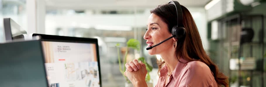 A Clearing phone line operator wearing a headset.