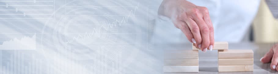 Image of a parent, with a building block, to illustrate building university links Image of a parent, with a building block, to illustrate building university links