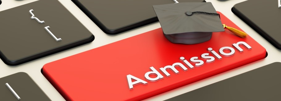 Image of admission text on a keyboard, with a graduation hat Image of admission text on a keyboard, with a graduation hat