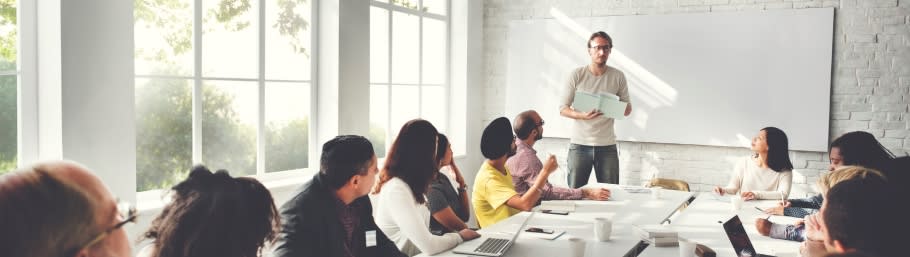 A member of a school liaison team presenting to a group of parents