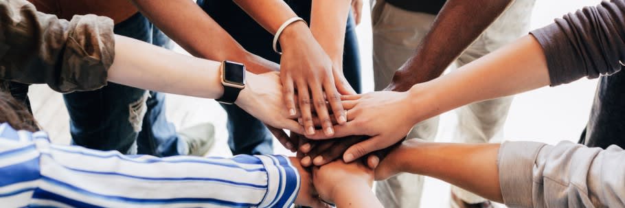An image of a group of students holding hands