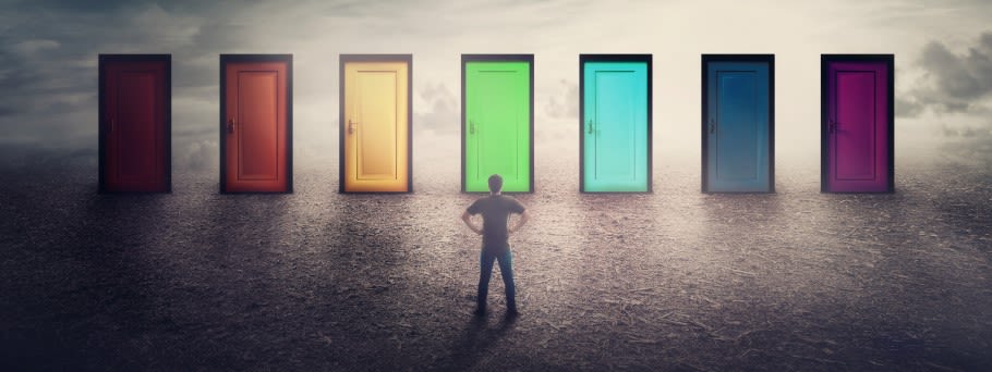 Image of a student looking at doors ahead of them, to illustrate different options Image of a student looking at doors ahead of them, to illustrate different options