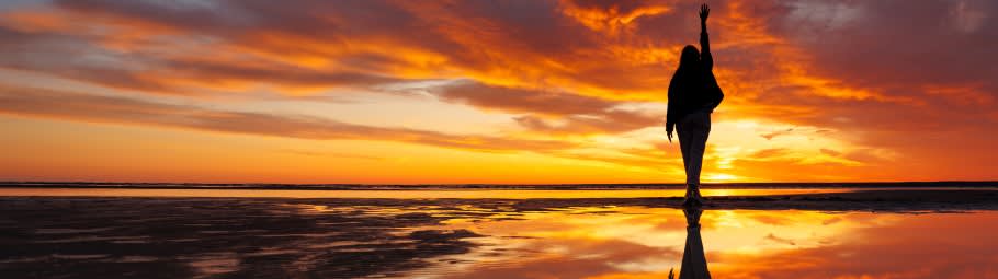 silhouette of a person against background beautiful sunset