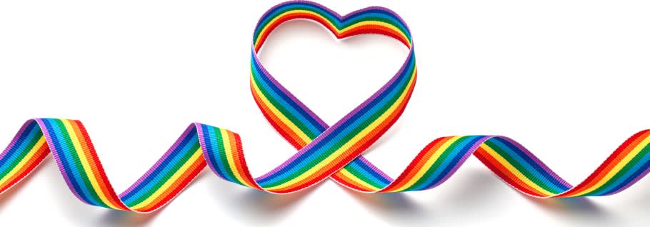 LGBT rainbow ribbon in the shape of heart. On a white background