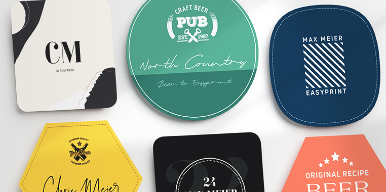 Verschiedene Bierdeckel-Designs, darunter sechseckige, quadratische und runde Formen mit kreativen Grafiken und Texten wie "North Country" und "Craft Beer Pub".