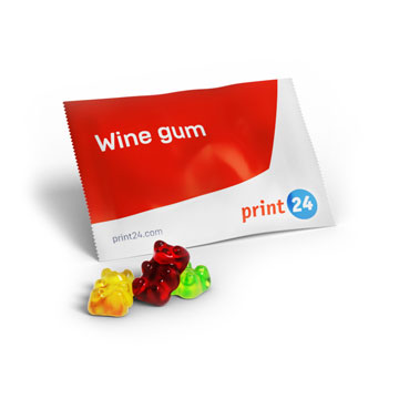 Caramelle gommose al vino in un accattivante packaging print24 – visualizzate con tre orsetti gommosi alla frutta colorati su uno sfondo chiaro
