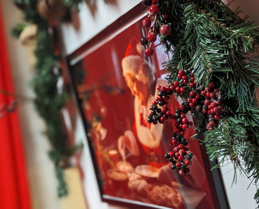 Framed photo of Mrs. Claus baking cookings