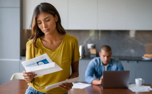 Woman looking at bill