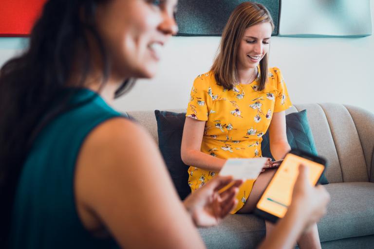 Two women discussing their finances