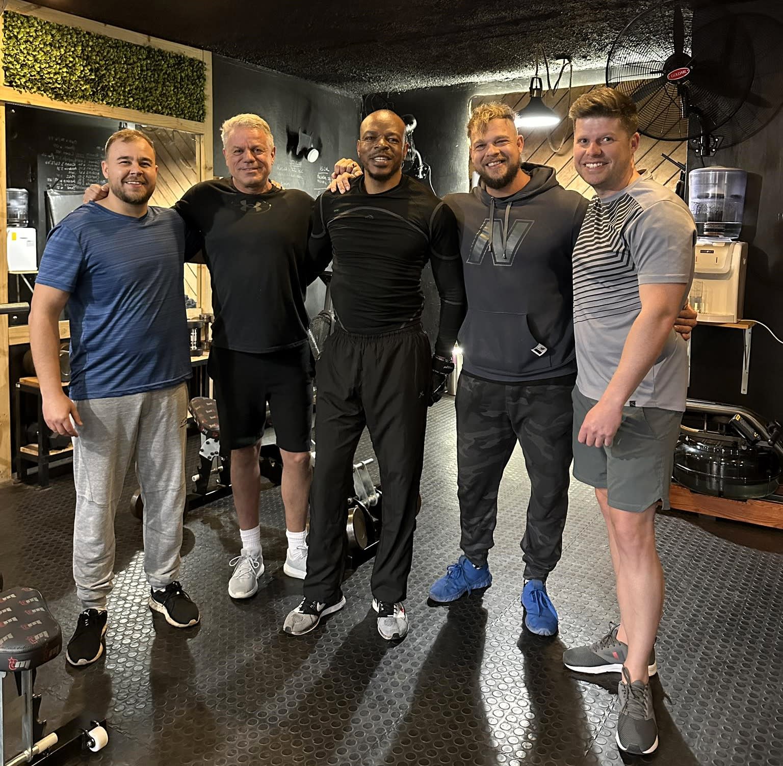 Group training session members inside the gym at XO Fit