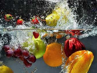 Fruit and vegetables splash into water Wall mural. picture 1