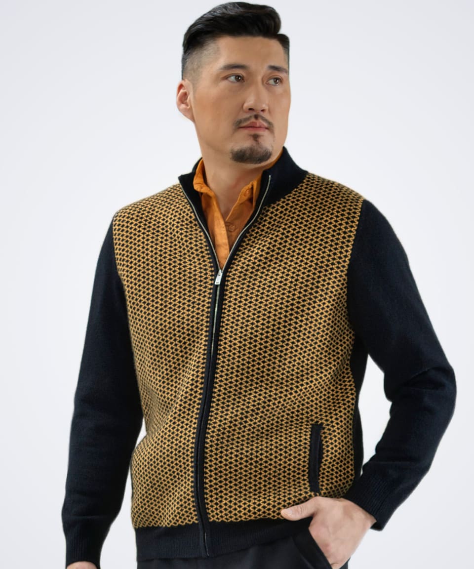 Man wearing a two-tone diamond patterned cardigan in brown, front