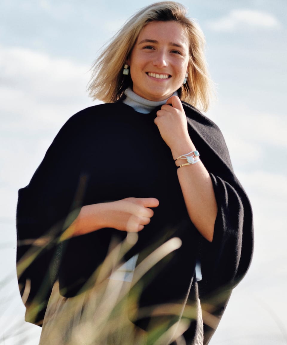 Women's black cashmere cape on model