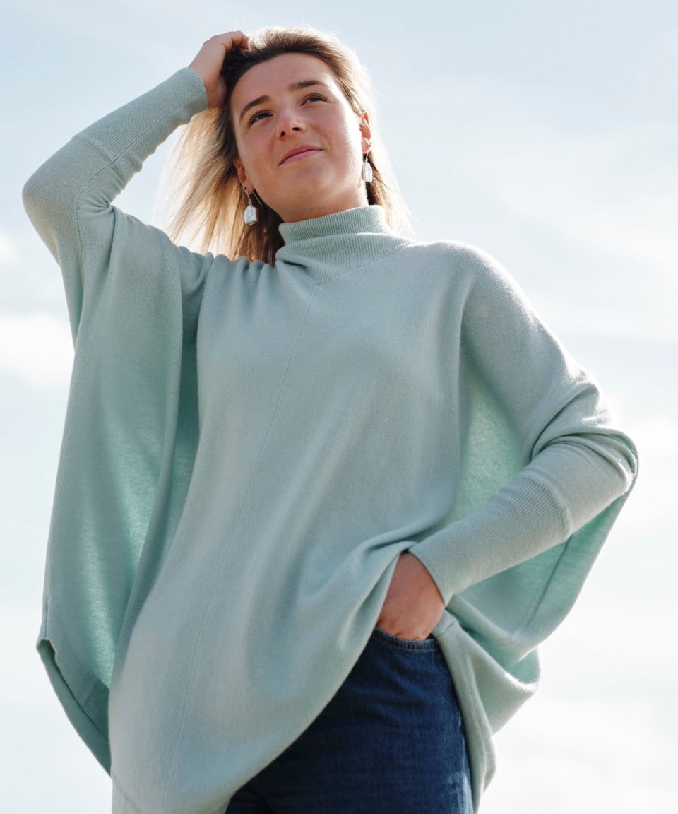 Women's mint green cashmere poncho on model