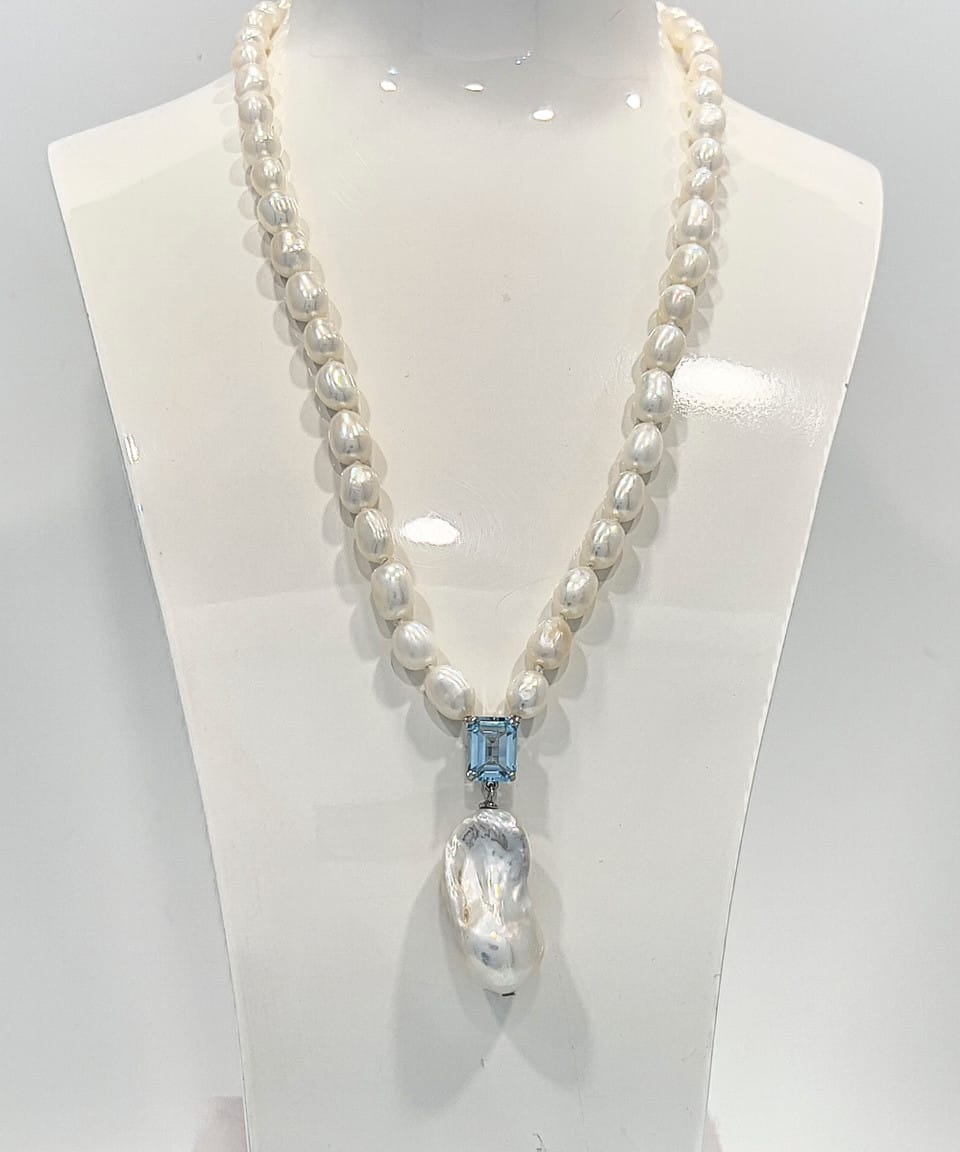 Signature baroque pearl pendant necklace with a square-cut topaz and delicate chain of smaller baroque pearls