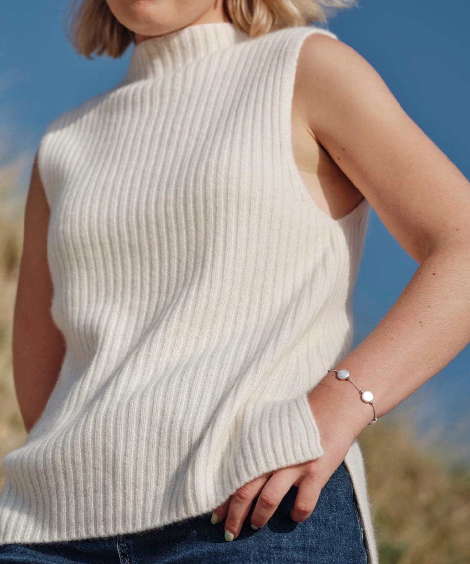Women's white cashmere ribbed piece on model