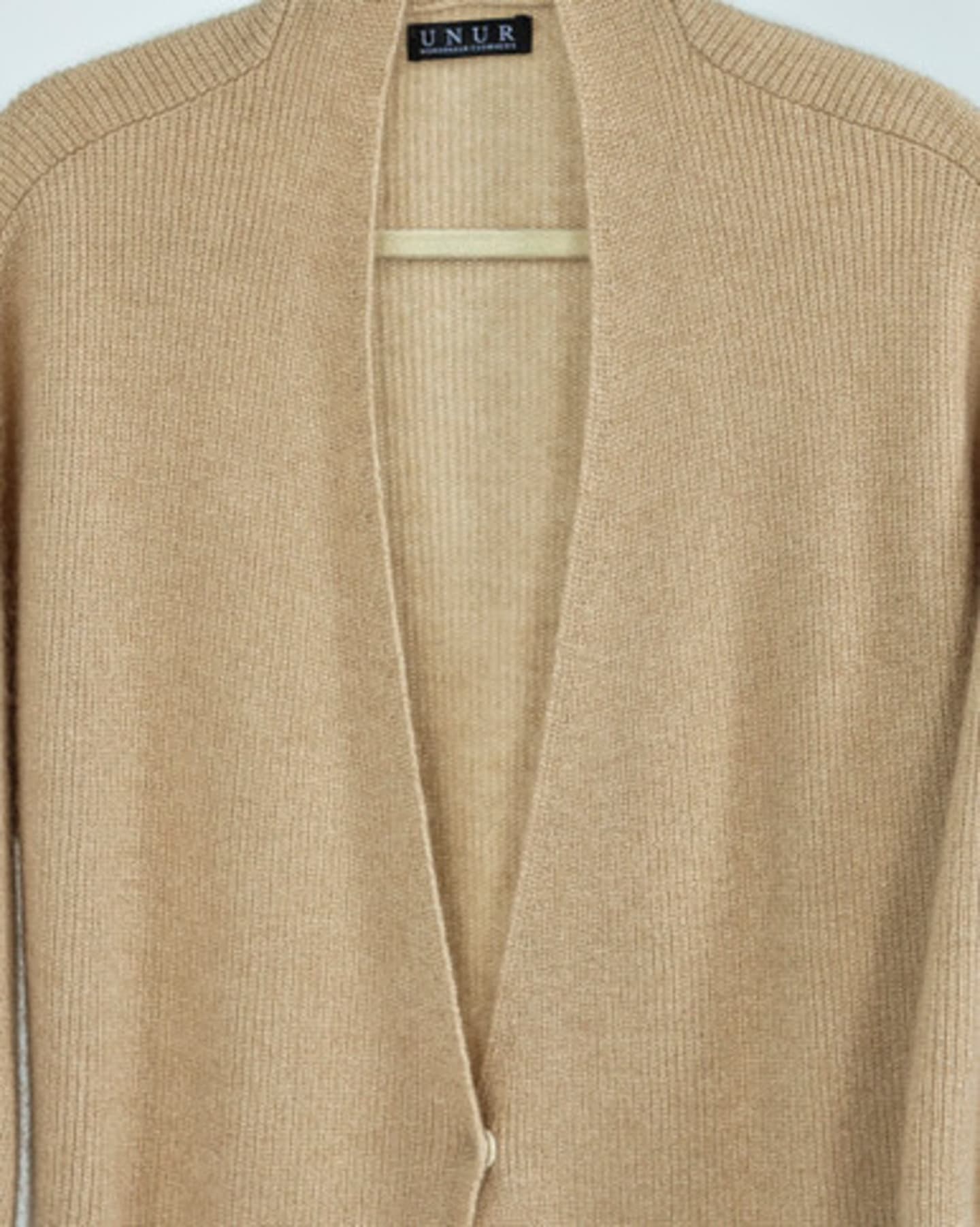 Close up of natural brown ribbed cashmere long cardigan coat