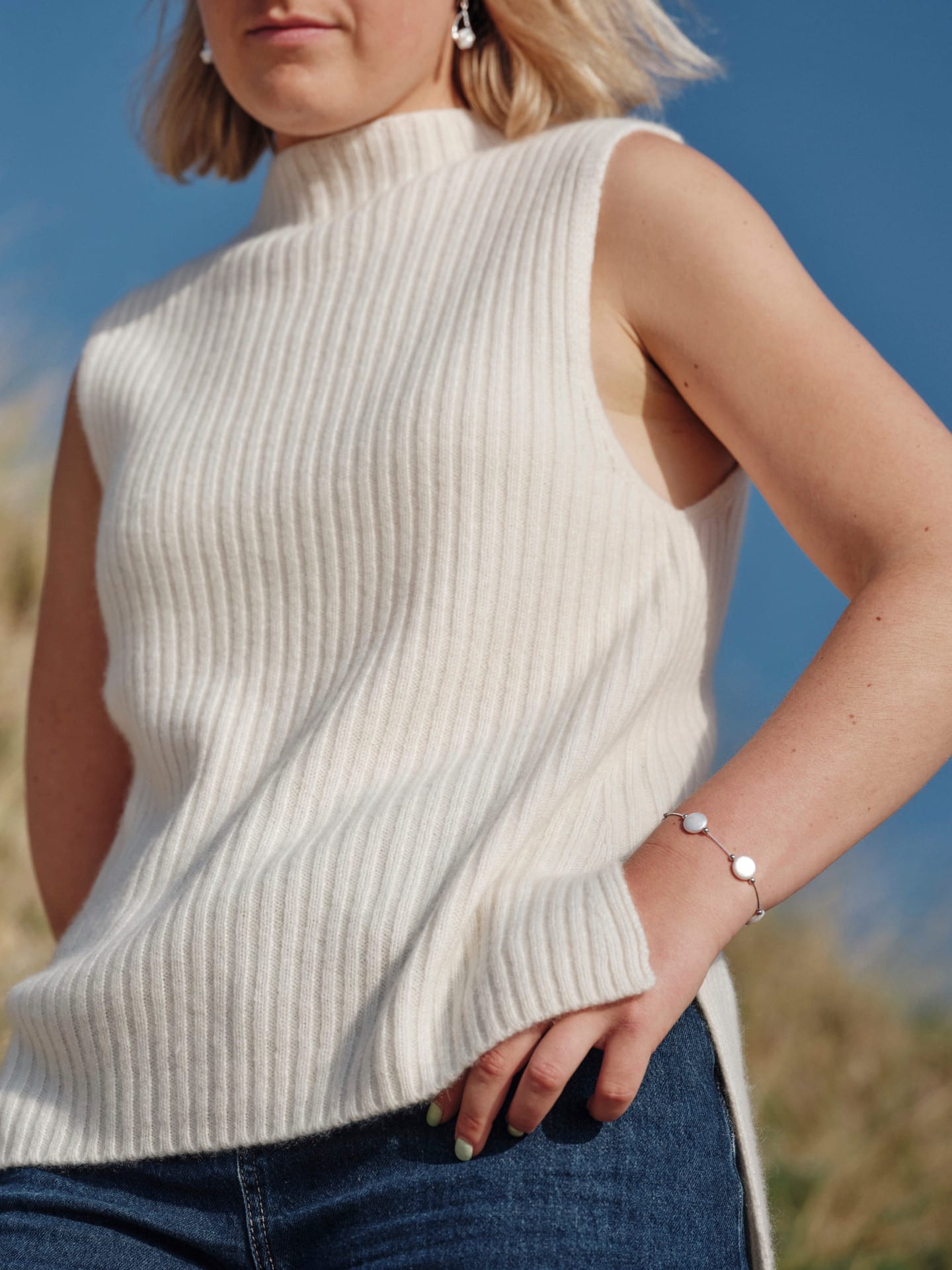 Women's white cashmere ribbed piece on model