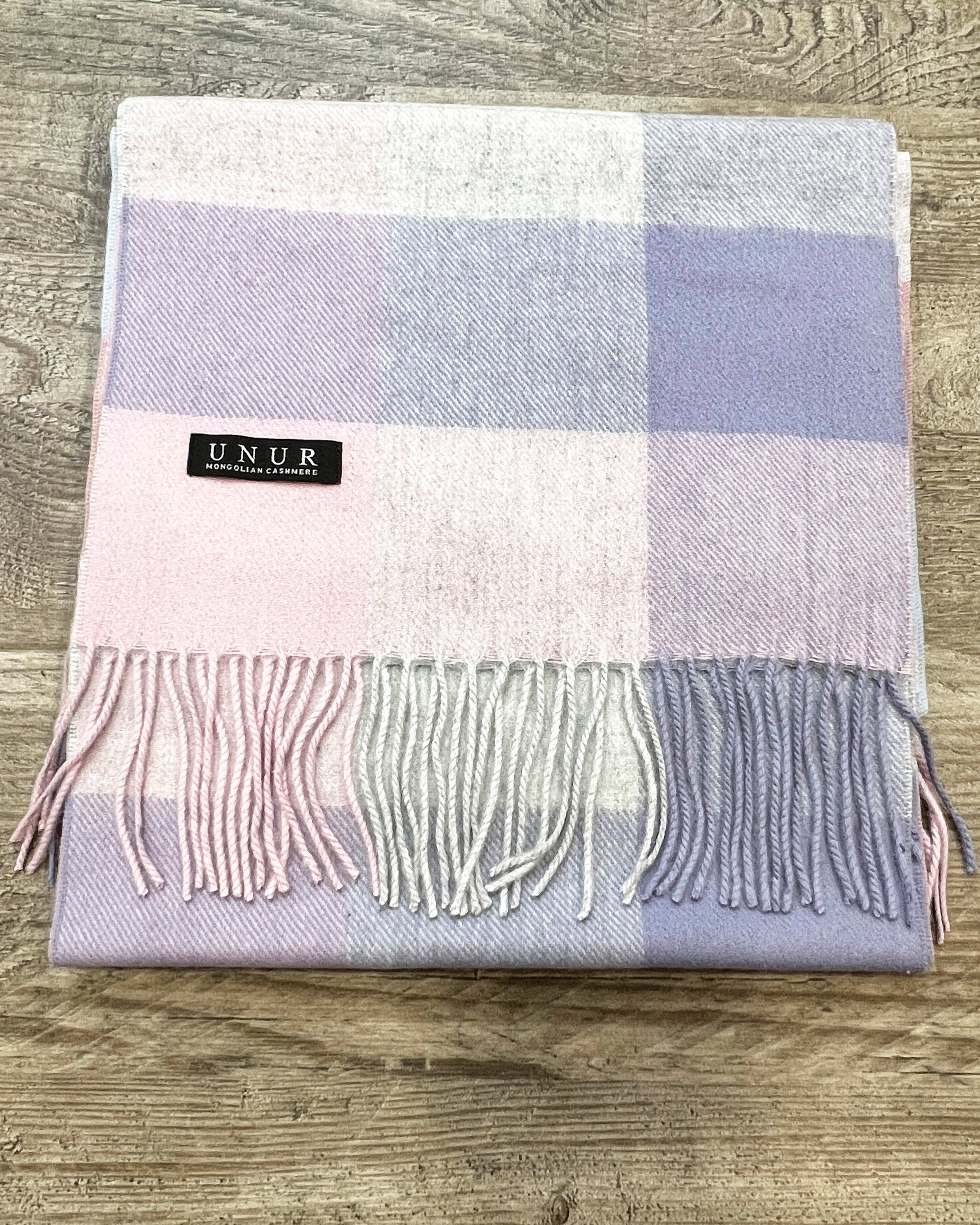 Lay-flat close up of check purple unisex woven cashmere scarf with tassles