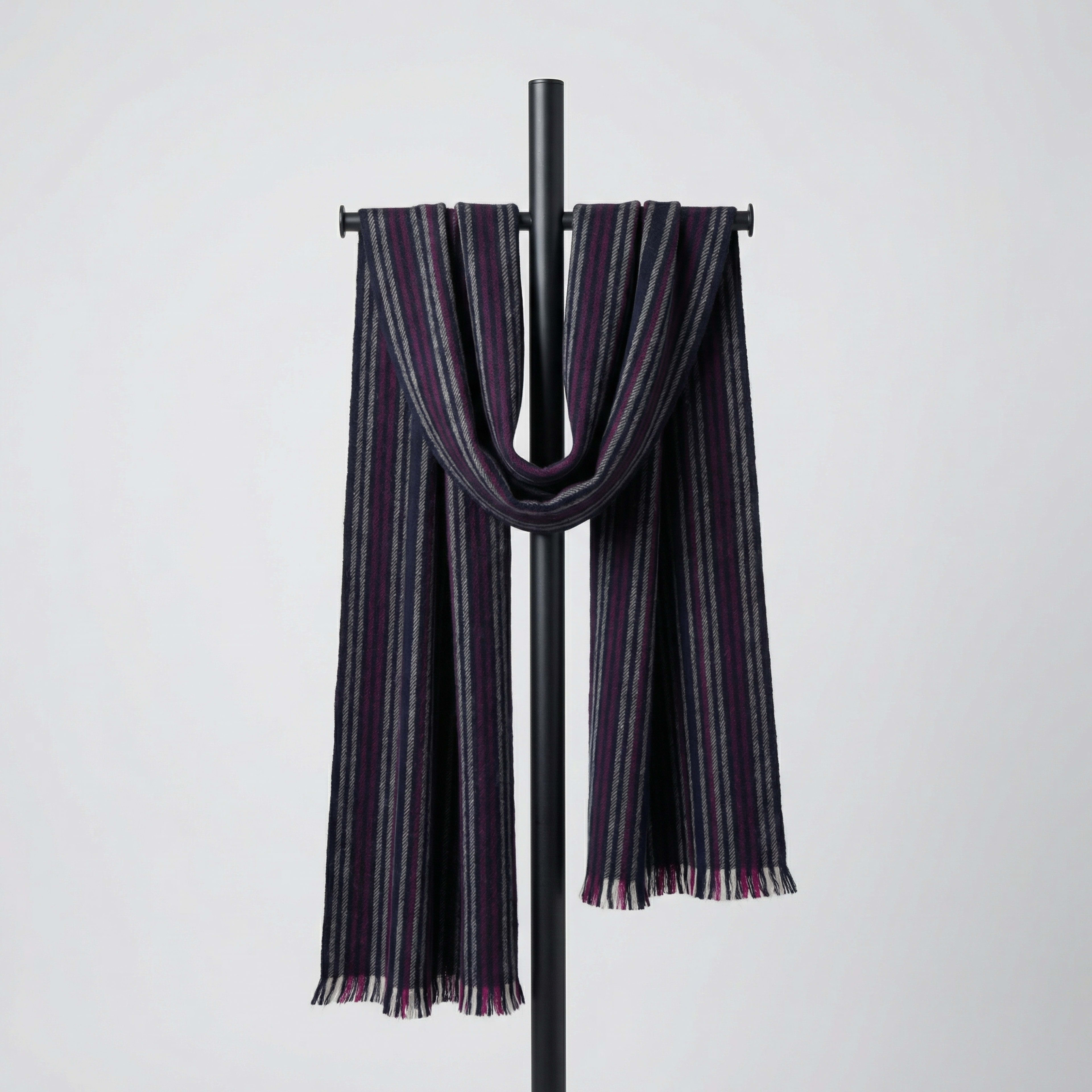 Men's cashmere pinstriped scarf on neutral background, draped on a hanger