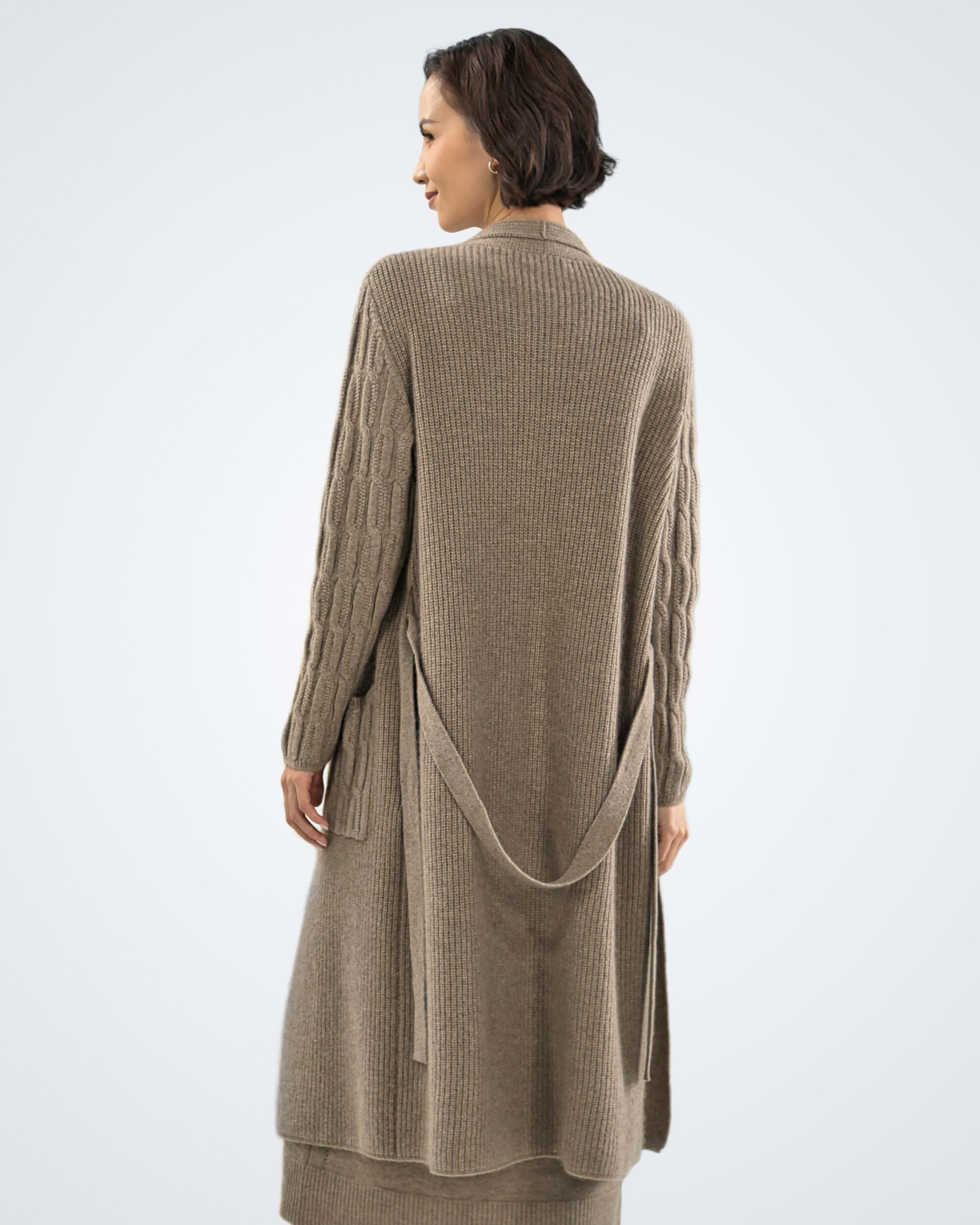 Back view of model wearing soft cashmere ribbed cardigan in natural brown