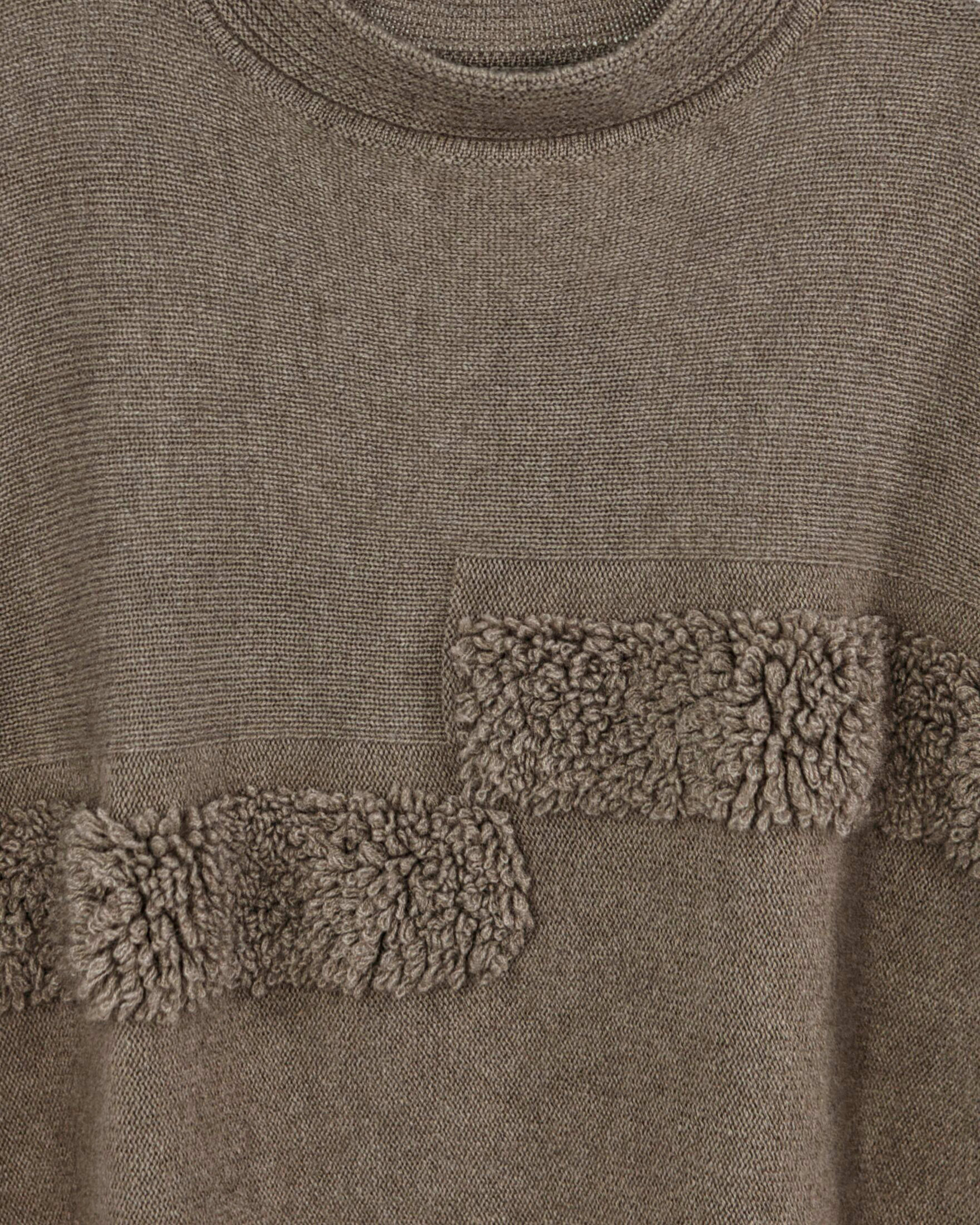 Close-up of soft cashmere ribbed poncho in natural brown