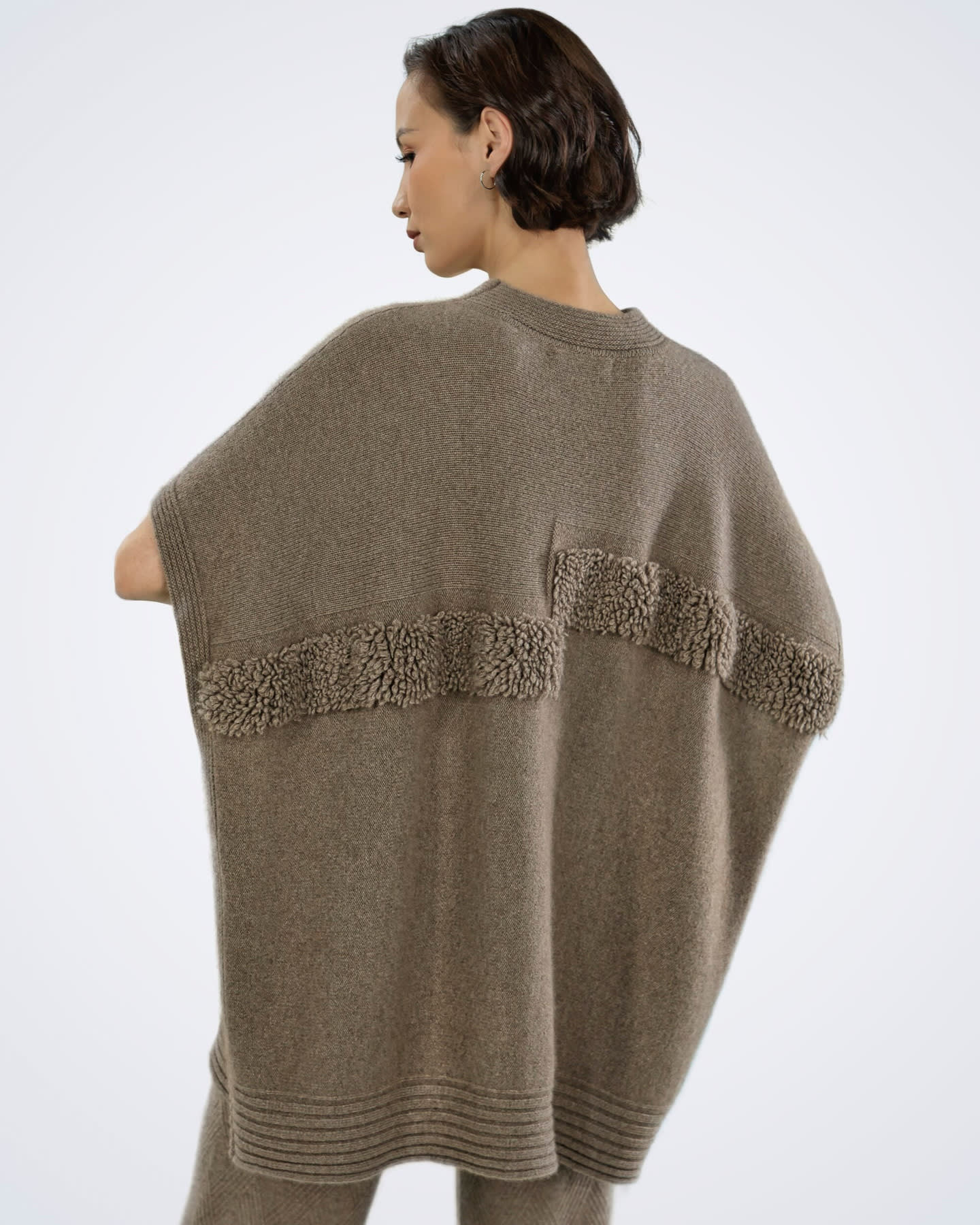 Back view of natural brown cashmere cape top showing boucle panel detail