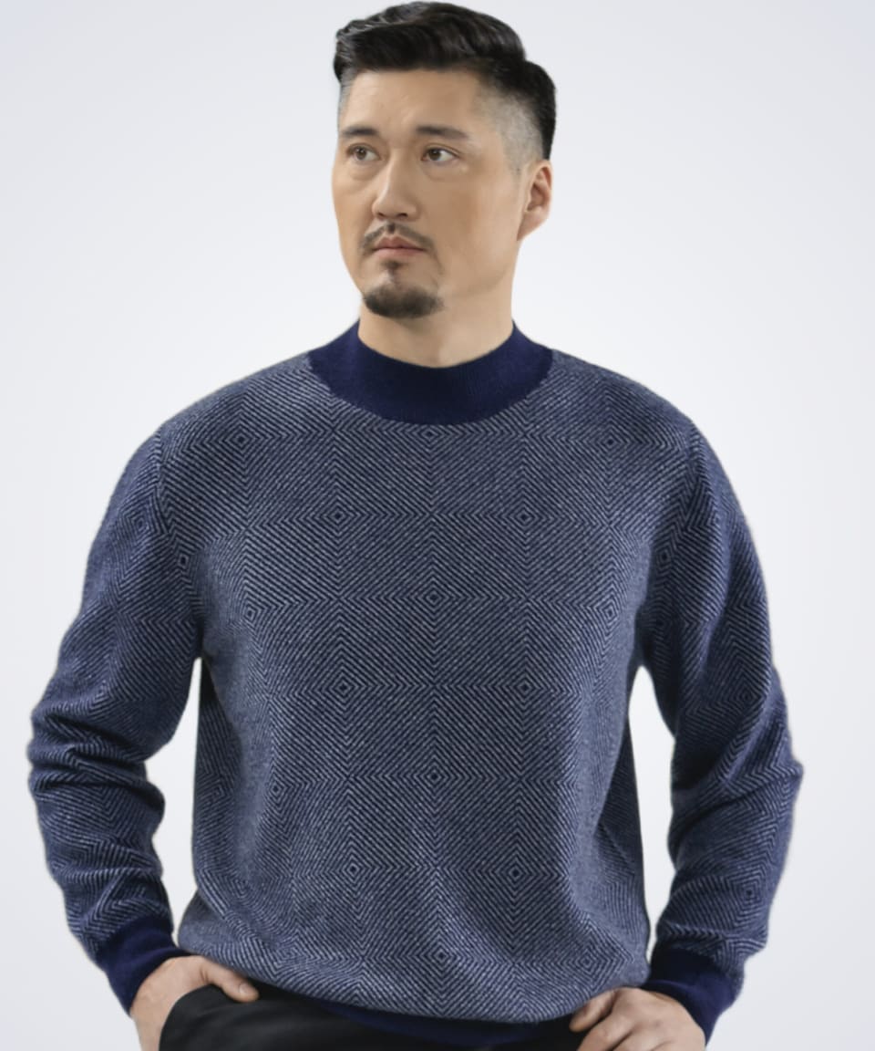 Man wearing a dark blue high neck cashmere jumper with diamond pattern, front view