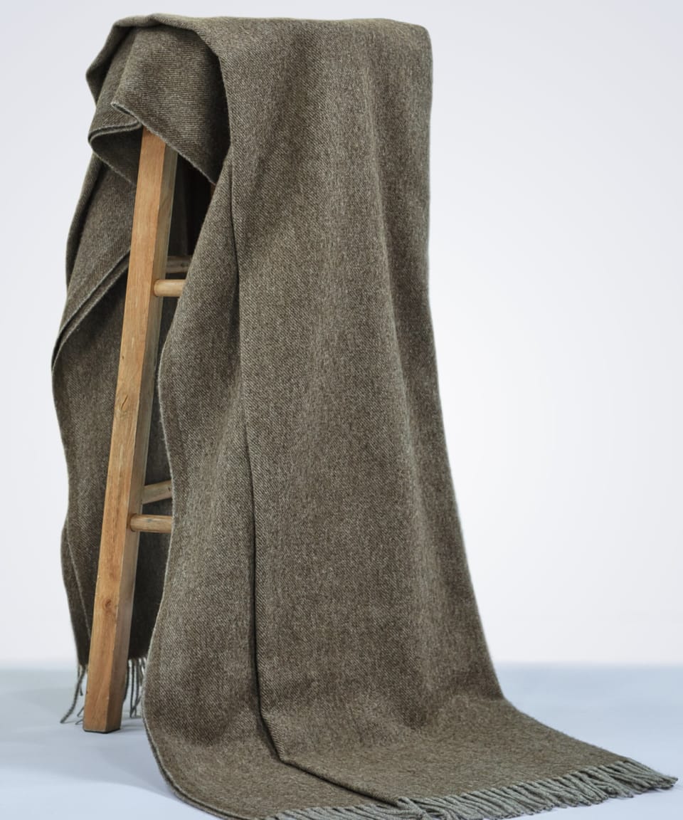natural brown yak wool blanket draped over a chair